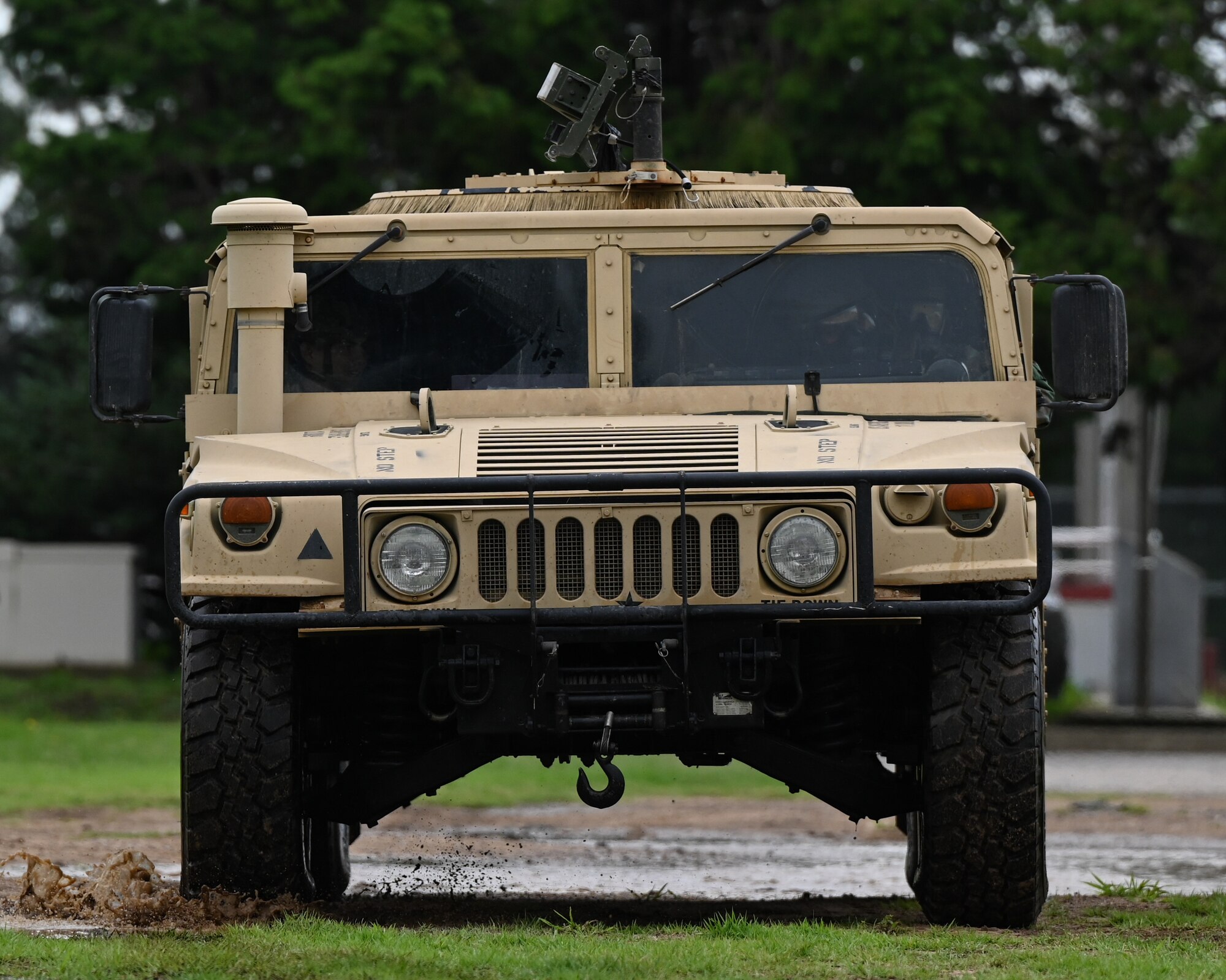 Airmen assigned to the 8th Security Forces Squadron practice driving a Humvee while wearing mission-oriented protective posture gear during chemical, biological, radioactive, nuclear driving training at Kunsan Air Base, Republic of Korea