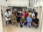 U.S. Soldiers and Airmen with the Vermont and New Hampshire National Guard pose for a photo with the medical staff at the Kedougou regional hospital in Kédougou, Senegal, June 7, 2024. The group was in Senegal for an annual medical readiness exercise.