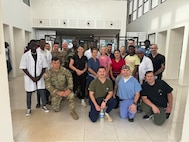U.S. Soldiers and Airmen with the Vermont and New Hampshire National Guard pose for a photo with the medical staff at the Kedougou regional hospital in Kédougou, Senegal, June 7, 2024. The group was in Senegal for an annual medical readiness exercise.