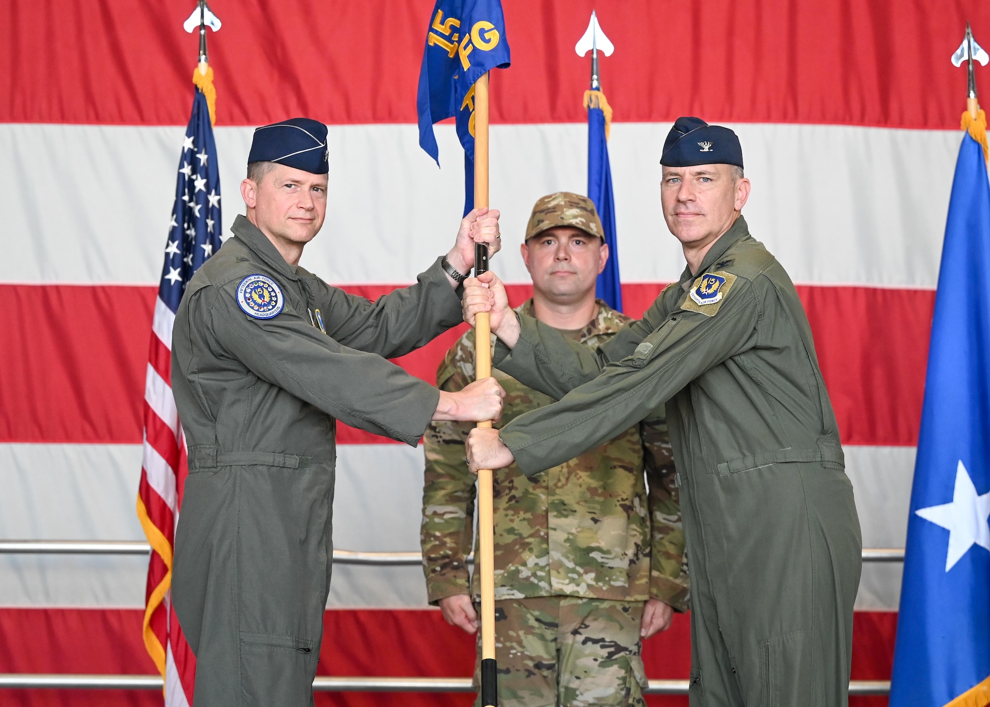 Gen Lyons passes a guidon to Col Whisler.