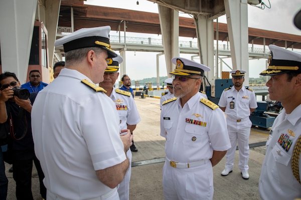 240717-N-WM182-1039 PORT KLANG, Malaysia (July 17, 2024) Vice Adm. Fred Kacher, commander, U.S. 7th Fleet, is greeted by senior members of the Royal Malaysian Navy following the arrival of the 7th Fleet flagship USS Blue Ridge (LCC 19) in Port Klang, Malaysia, July 17, 2024. 7th Fleet is the U.S. Navy's largest forward-deployed numbered fleet, and routinely interacts and operates with allies and partners in preserving a free and open Indo-Pacific region. (U.S. Navy Photo by Mass Communication Specialist 2nd Class Caitlin Flynn)