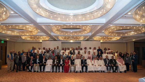 Participants and guests pose for a group photo during the inaugural Multinational Combat Casualty Care Engagement “Beyond Borders: Managing Casualties Across Warfare Continuum” conference, July 1–3.