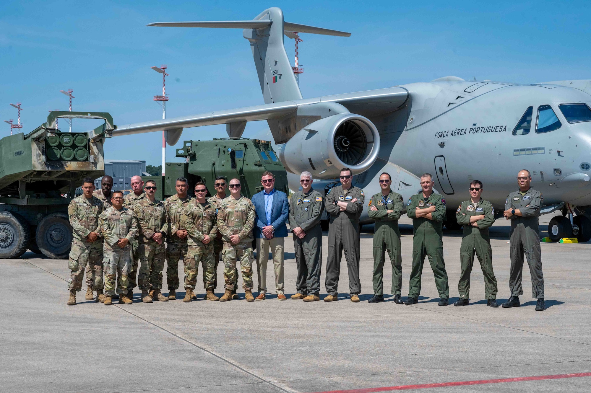 U.S. Air Force, Army, and Portuguese Air Force members assemble for a group photo