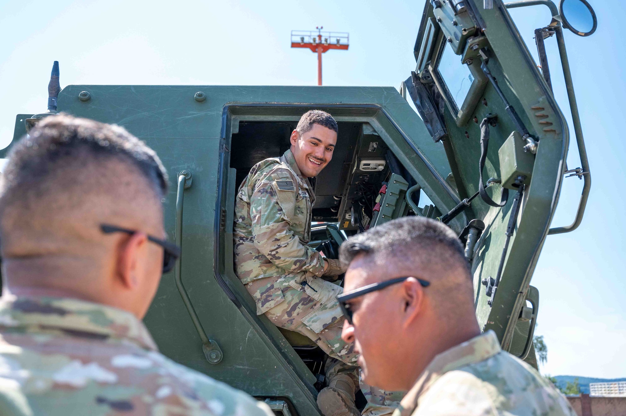 U.S. Soldiers with the 4-133rd Field Artillery Regiment discuss M142 High Mobility Rocket System operations during cold load training