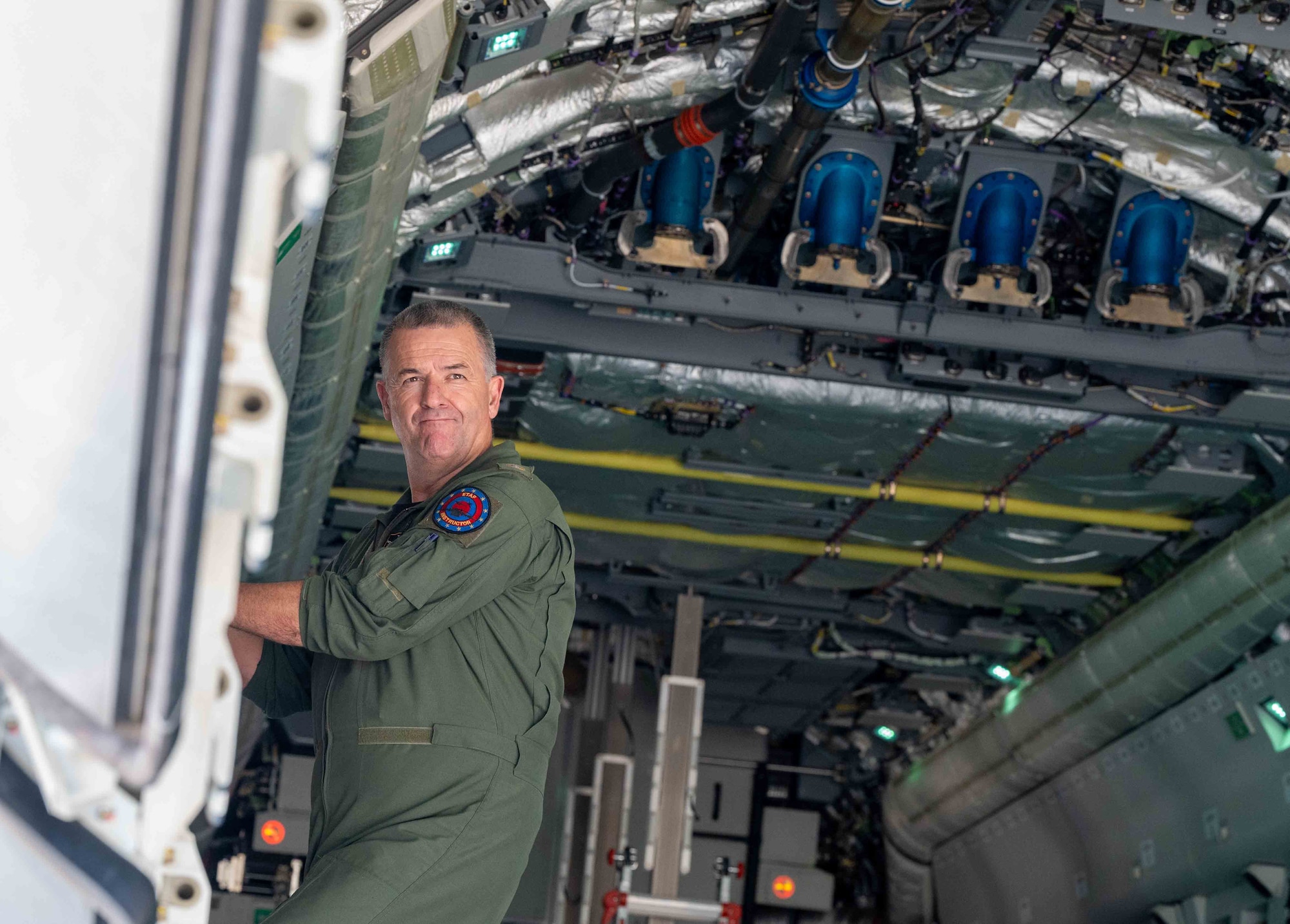 Portuguese Air Force Master Sgt. Hugo Coelho, 506th Squadron loadmaster, closes the KC-390 Millennium aircraft cargo bay door during cold load training