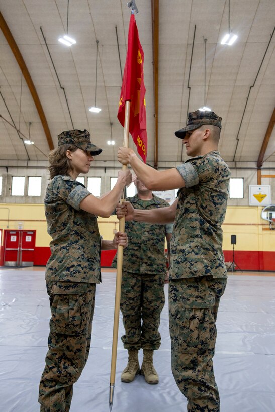Captain William Bomchill relinquished command of base Marines to Capt. Elizabeth Kemp during Headquarters Company (HQCO) Change of Command located at the Fitness Center aboard Marine Corps Logistics Base Barstow, Ca. on July 12