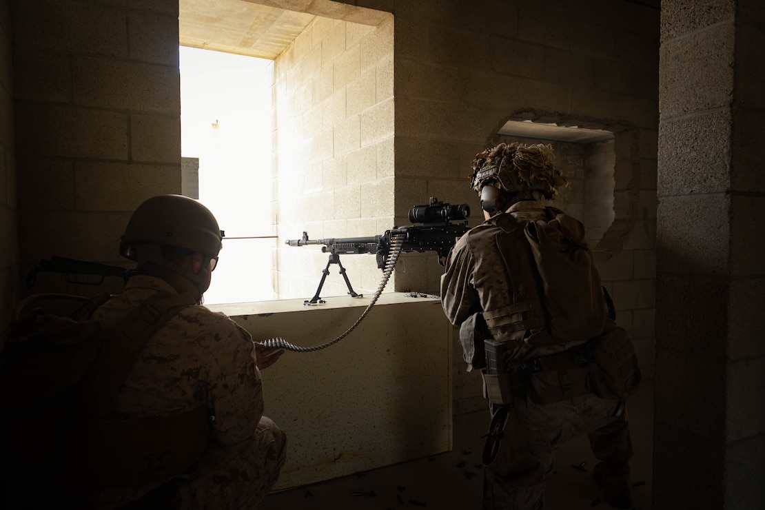 U.S. Marine Corps Pfc. Ardeth Maldonado (left), a rifleman, and Lance Cpl. Brecken Wilcoxen, a team leader, with 2nd Battalion, 4th Marine Regiment, 1st Marine Division, act as the opposing force of a raid during a raid leaders course hosted by Expeditionary Operations Training Group, I Marine Expeditionary Force at Marine Corps Base Camp Pendleton, California, July 11, 2024. The Amphibious Raids Branch of EOTG conducted the RLC to train 2nd Battalion, 4th Marines small-unit leaders in raid fundamentals and in preparation for their upcoming deployment with the 31st Marine Expeditionary Unit.