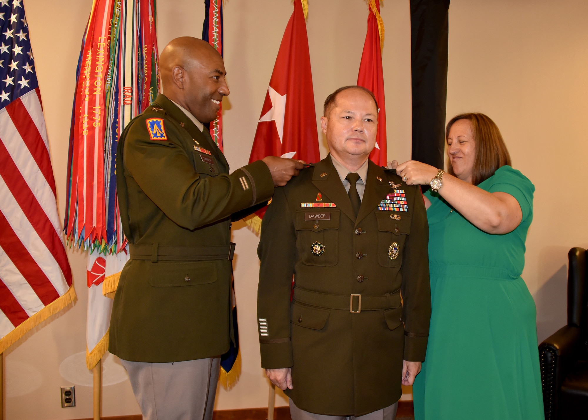 Photo By Dottie White | Lt. Gen. Sean A. Gainey, commanding general, U.S. Space and Missile Defense Command, and Jennifer Dawber, wife of SMDC Deputy Commanding General for Operations Brig. Gen. John L. Dawber, pin on Dawber's new rank during his promotion ceremony at Peterson Space Force Base, Colorado, July 12.