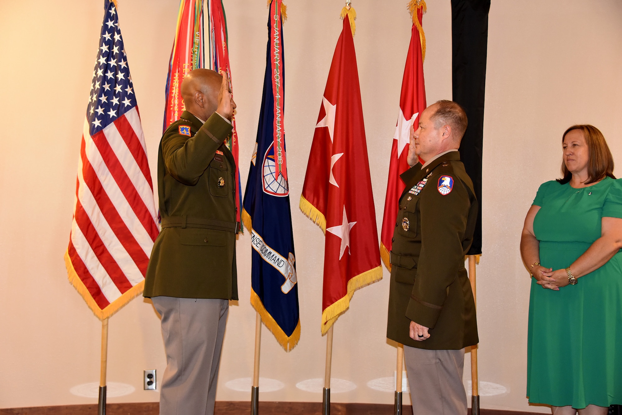 Lt. Gen. Sean A. Gainey, commanding general, U.S. Space and Missile Defense Command, administers the oath of office to Brig. Gen. John L. Dawber, SMDC deputy commanding general for operations, during Dawber's promotion ceremony at Peterson Space Force Base, Colorado, July 12, 2024. (U.S. Army photo by Dottie White)