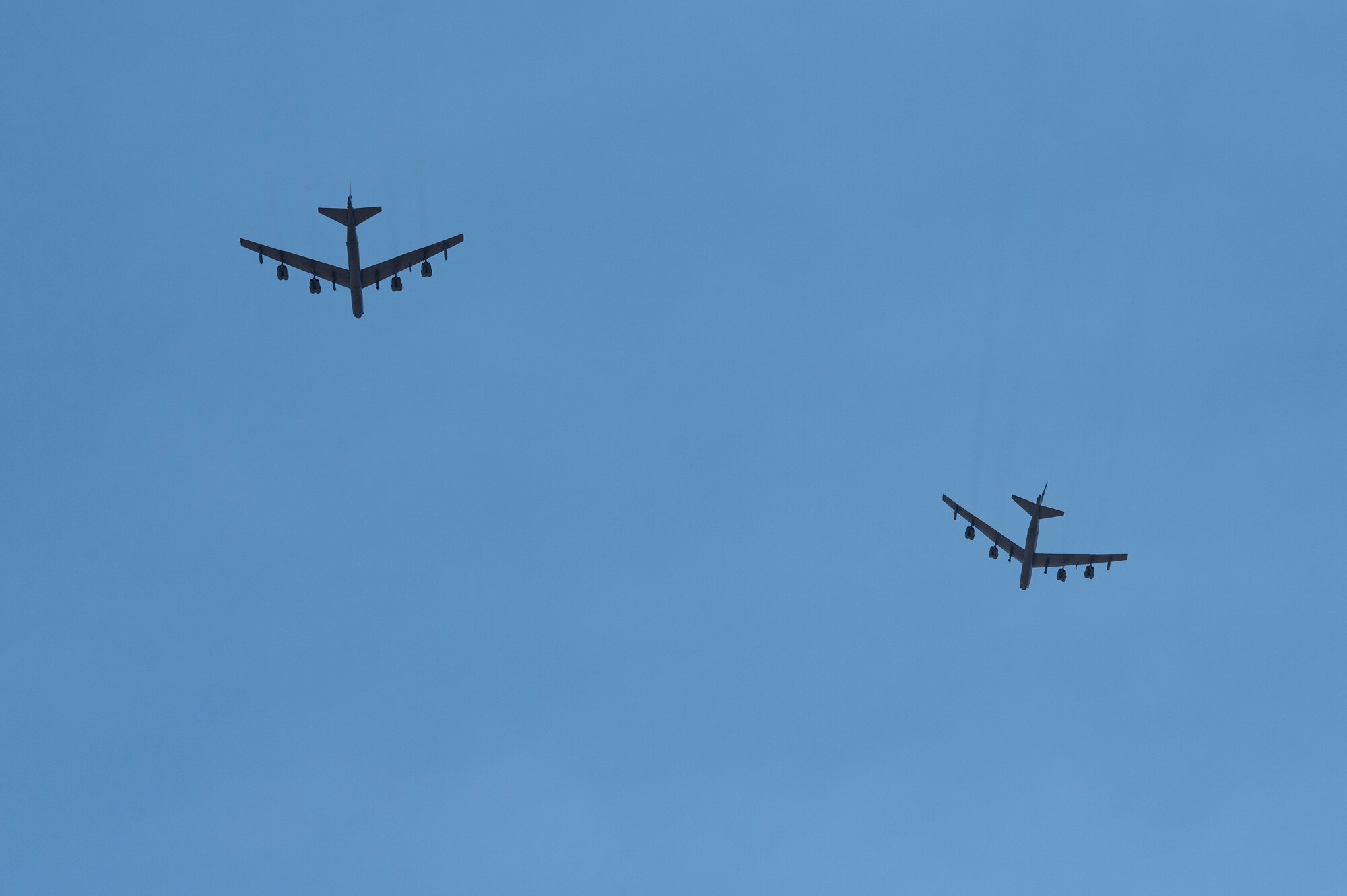 Two B-52 Stratofortresses assigned to the 23rd Bomb Squadron at Minot Air Force Base, North Dakota fly over Dyess Air Force Base, Texas, July 15, 2024. Several B-52s and Airmen from Minot AFB came to Dyess AFB to participate in an Agile Combat Employment exercise, dubbed Agile Warbird. (U.S. Air Force photo by Airman 1st Class Emma Anderson)