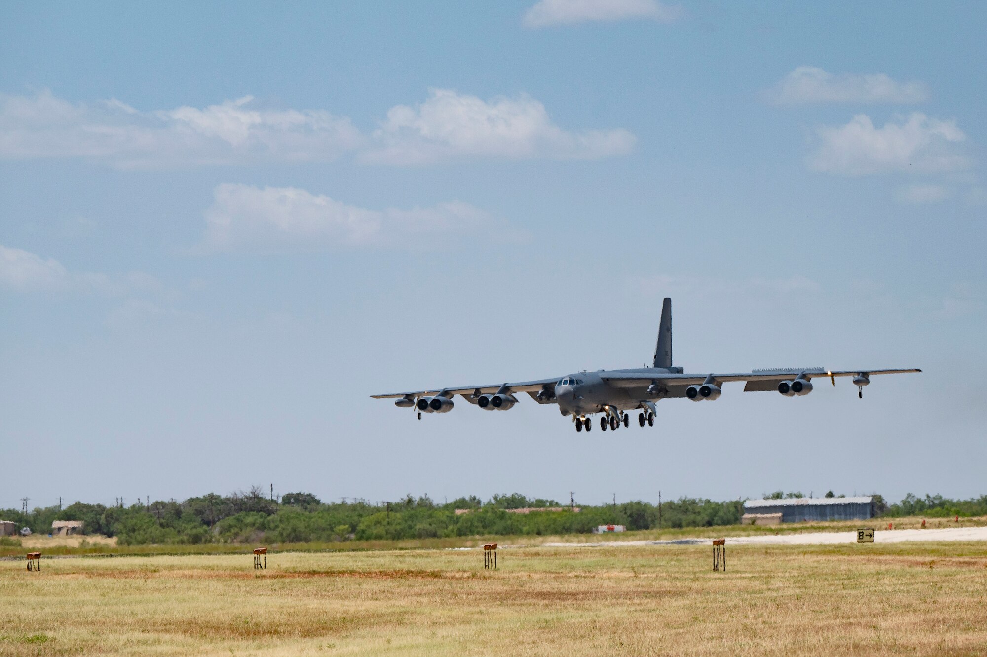 A B-52 Stratofortress assigned to the 23rd Bomb Squadron at Minot Air Force Base, North Dakota, lands at Dyess Air Force Base, Texas, July 15, 2024. Team Minot will integrate into the 7th Bomb Wing’s daily operations in order to maintain readiness and proficiency and utilize unique training opportunities. (U.S. Air Force photo by Airman 1st Class Emma Anderson)