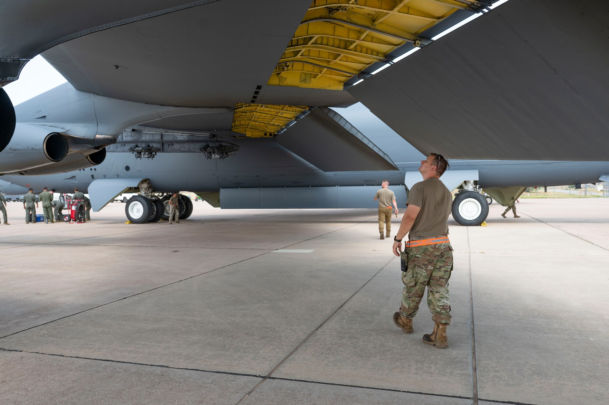 An Airman from Minot Air Force Base, North Dakota, inspects the wing of a B-52 Stratofortress at Dyess Air Force Base, Texas, July 15, 2024. Several B-52s and Airmen from Minot AFB came to Dyess AFB to participate in an Agile Combat Employment exercise, dubbed Agile Warbird. (U.S. Air Force photo by Airman 1st Class Emma Anderson)