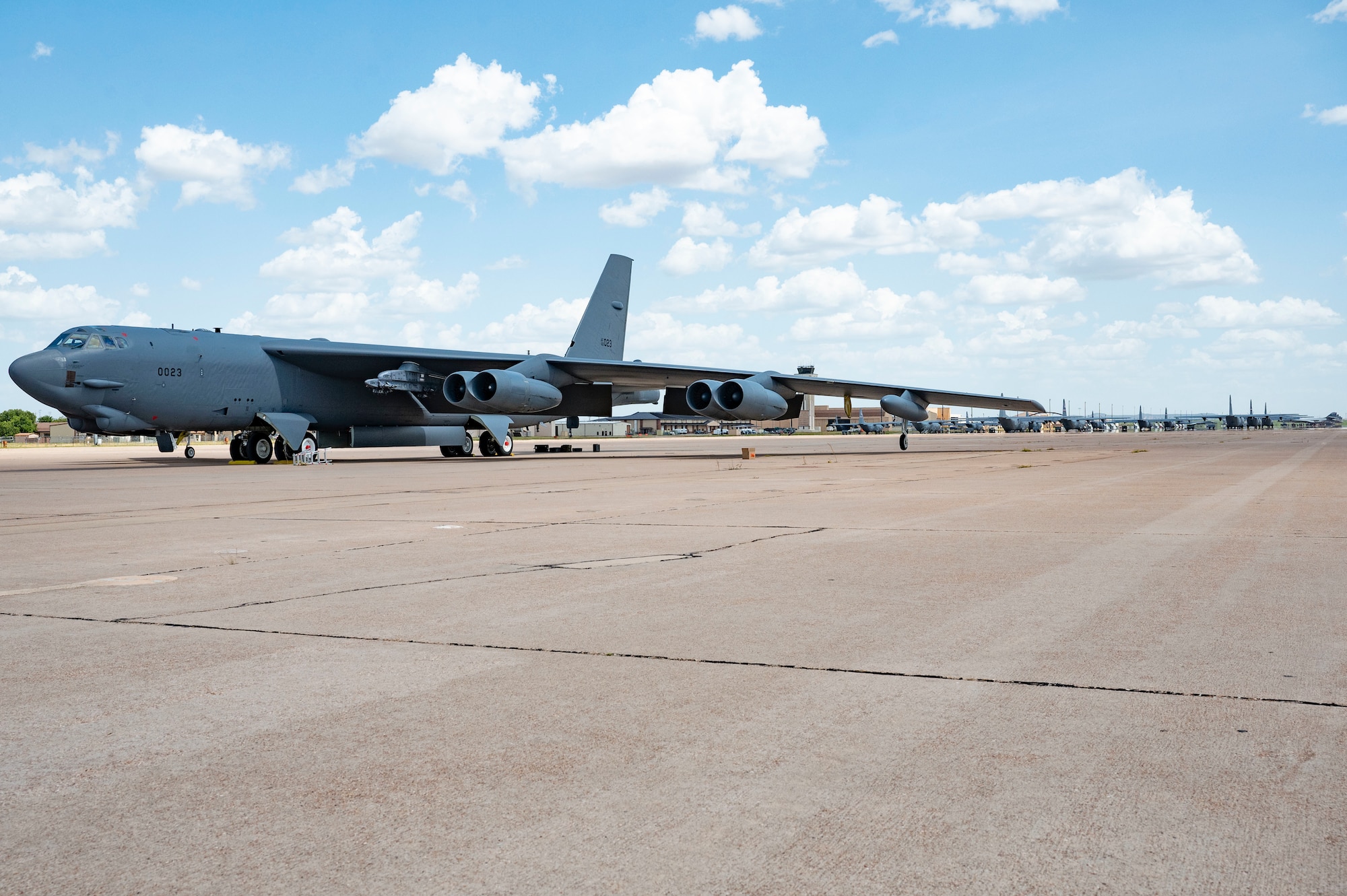 A B-52 Stratofortress assigned to the 23rd Bomb Squadron at Minot Air Force Base, North Dakota, sits on the apron at Dyess Air Force Base, Texas, July 15, 2024. The aircraft are operating out of Dyess while upgrades are being made to the Minot runway, showcasing their ability to operate at forward locations. (U.S. Air Force photo by Airman 1st Class Emma Anderson)