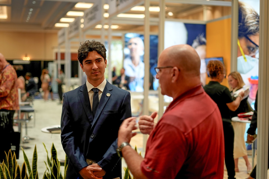 Shaun Frost, hiring manager and chief of the U.S. Army Corps of Engineers Los Angeles District’s Construction Division, right, provides information about employment opportunities to an attendee of the 2024 League of United Latin American Citizens National Convention and Exhibition July 26 in Las Vegas.