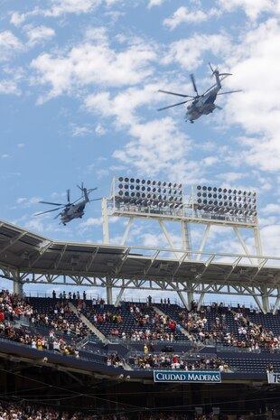 U.S. Marines with Marine Heavy Helicopter Squadron 465 conduct a flyover at Petco Park Stadium, San Diego, July 14, 2024. U.S. Marines attended the San Diego Padres’ Military Salute to the Marine Corps to honor the commitment of the U.S. Marines and connect with the San Diego community. (U.S. Marine Corps photo by Sgt. Patrick King)