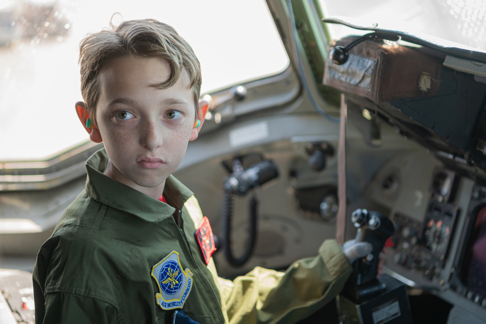 McCoy Cannon, Team McChord’s newest 12-year-old “Pilot for a Day” participant, sits inside of a static C-17 Globemaster III at Joint Base Lewis-McChord, Washington, July 11, 2024.