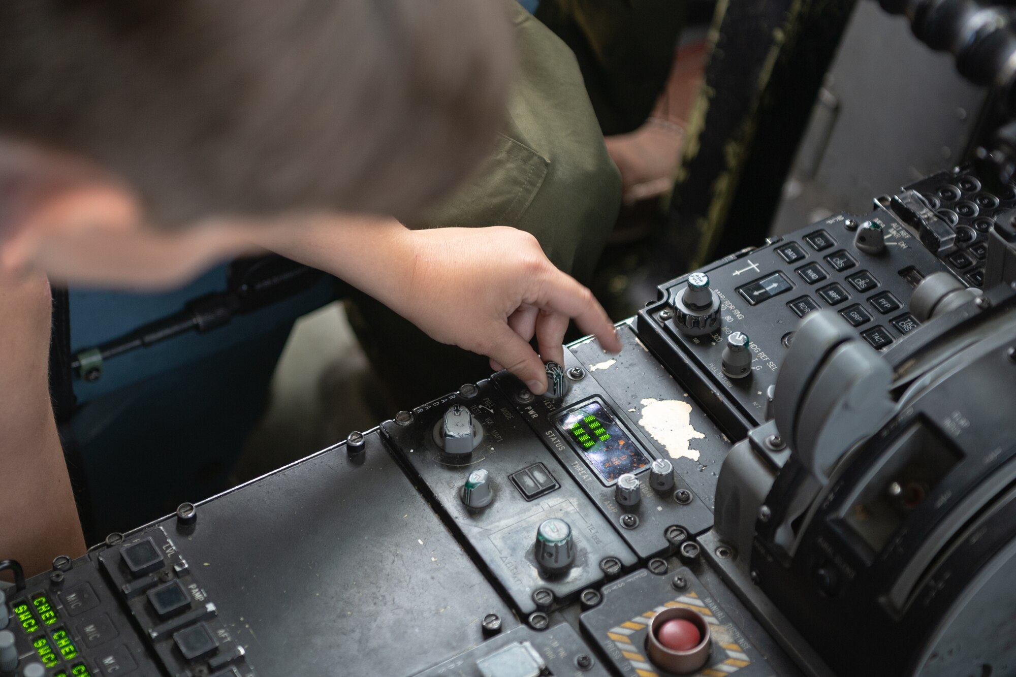 Mason Cannon turns a dial inside a C-17 Globemaster III’s flight deck at Joint Base Lewis-McChord, Washington, July 11, 2024.