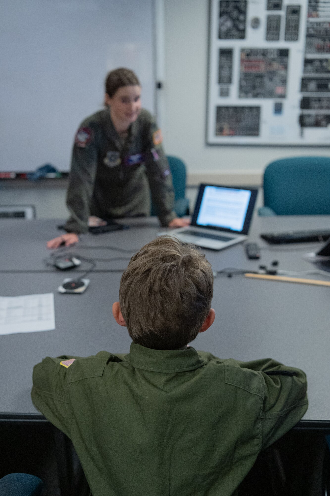 McCoy Cannon, Team McChord’s newest 12-year-old “Pilot for a Day” participant, attends a “secret” briefing before climbing into the C-17 Globemaster III simulator at Joint Base Lewis-McChord, Washington, July 11, 2024.