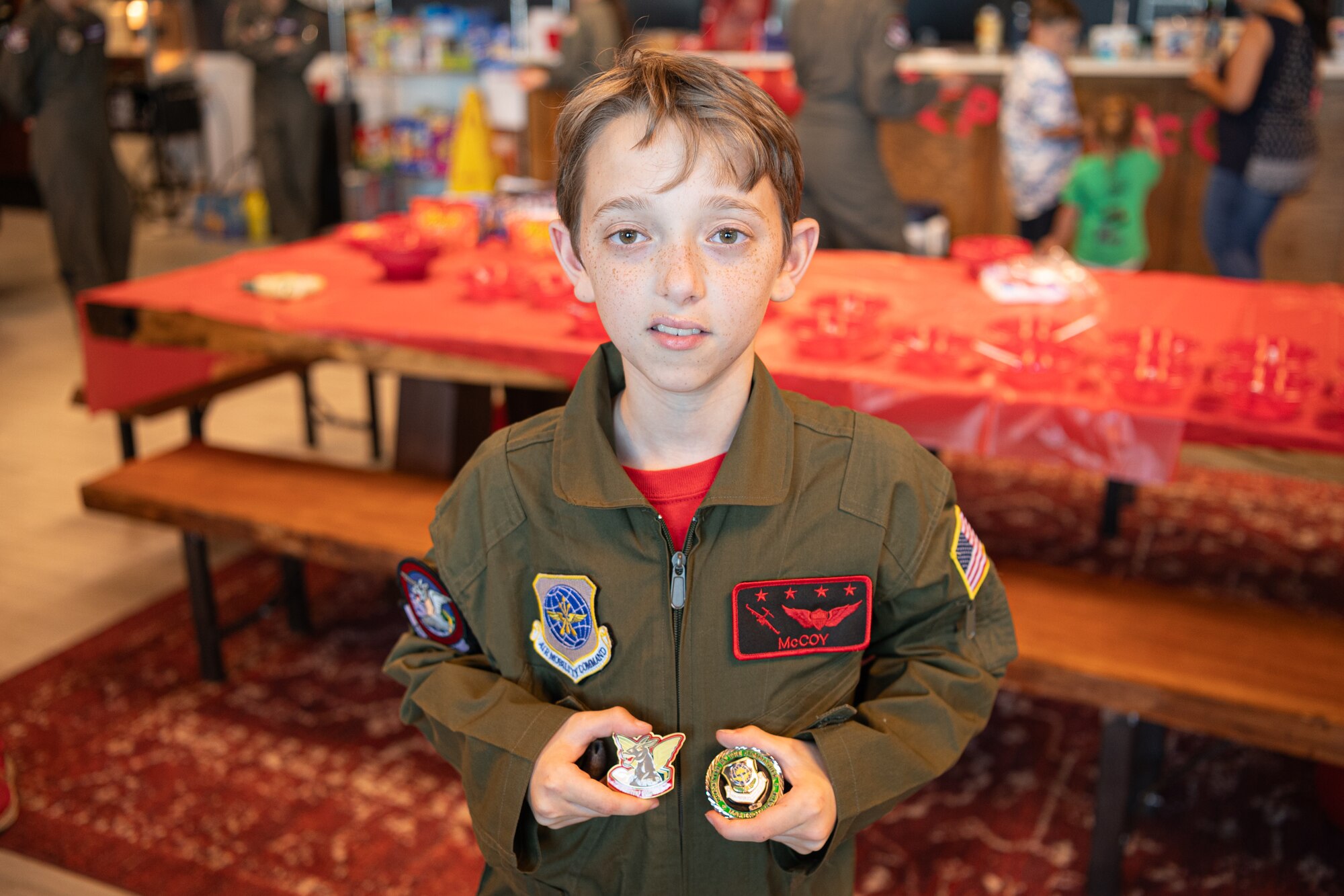 McCoy Cannon, Team McChord’s newest 12-year-old “Pilot for a Day” participant, salutes before riding in an aircraft rescue and firefighting truck at Joint Base Lewis-McChord, Washington, July 11, 2024.