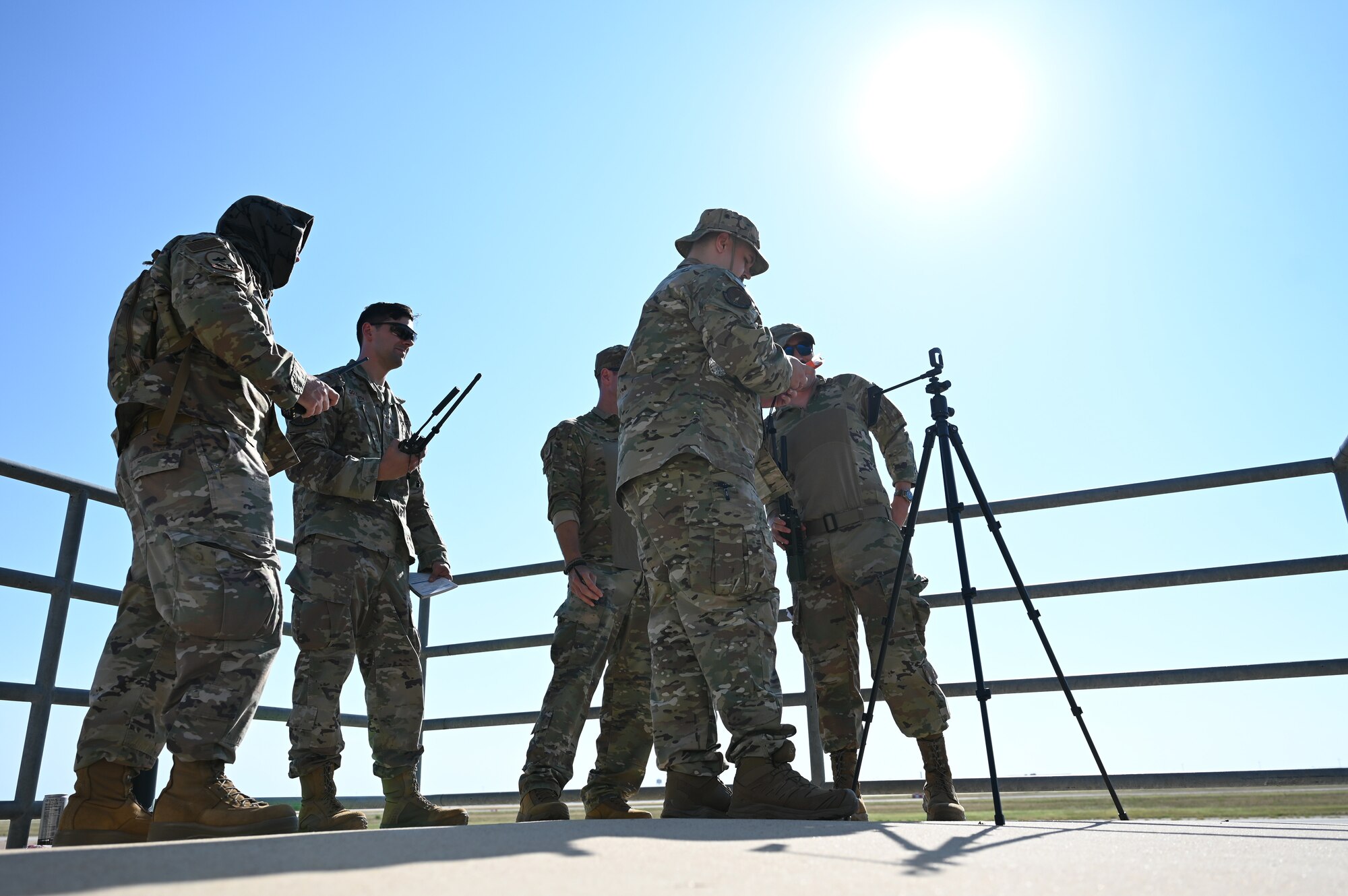 Landing Zone Safety Officer Exercise participants prepare for an incoming C-130J Super Hercules during the LZSO Exercise at Dyess Air Force Base, Texas, July 12, 2024. The 7th OSS hosts the LZSO exercise to keep air traffic control personnel up to date on skills they may use in deployed or underdeveloped locations by sending them through a series of tasks to ensure the safe landing of military aircraft. (U.S. Air Force photo by Staff Sgt. Holly Cook)