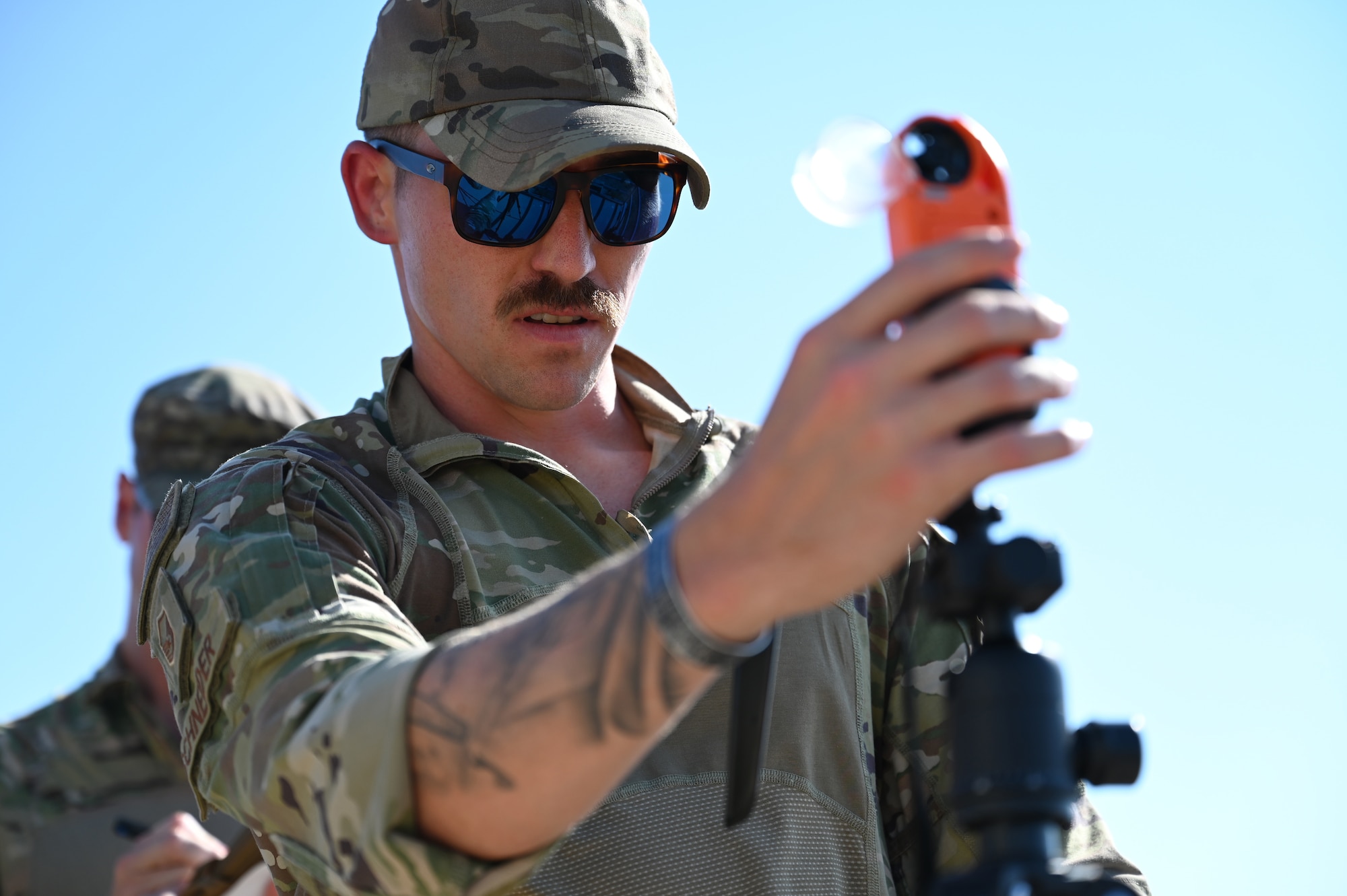 Master Sgt. Brody Schneider, 7th Operations Support Squadron chief controller, checks the wind speed on a wind and weather meter during the Landing Zone Safety Officer Exercise at Dyess Air Force Base, Texas, July 12, 2024. Seven air traffic control Airmen spent two weeks honing skills used in deployed and underdeveloped locations bringing Agile Combat Employment to the forefront of the Air Force airfield operations career fields. (U.S. Air Force photo by Staff Sgt. Holly Cook)