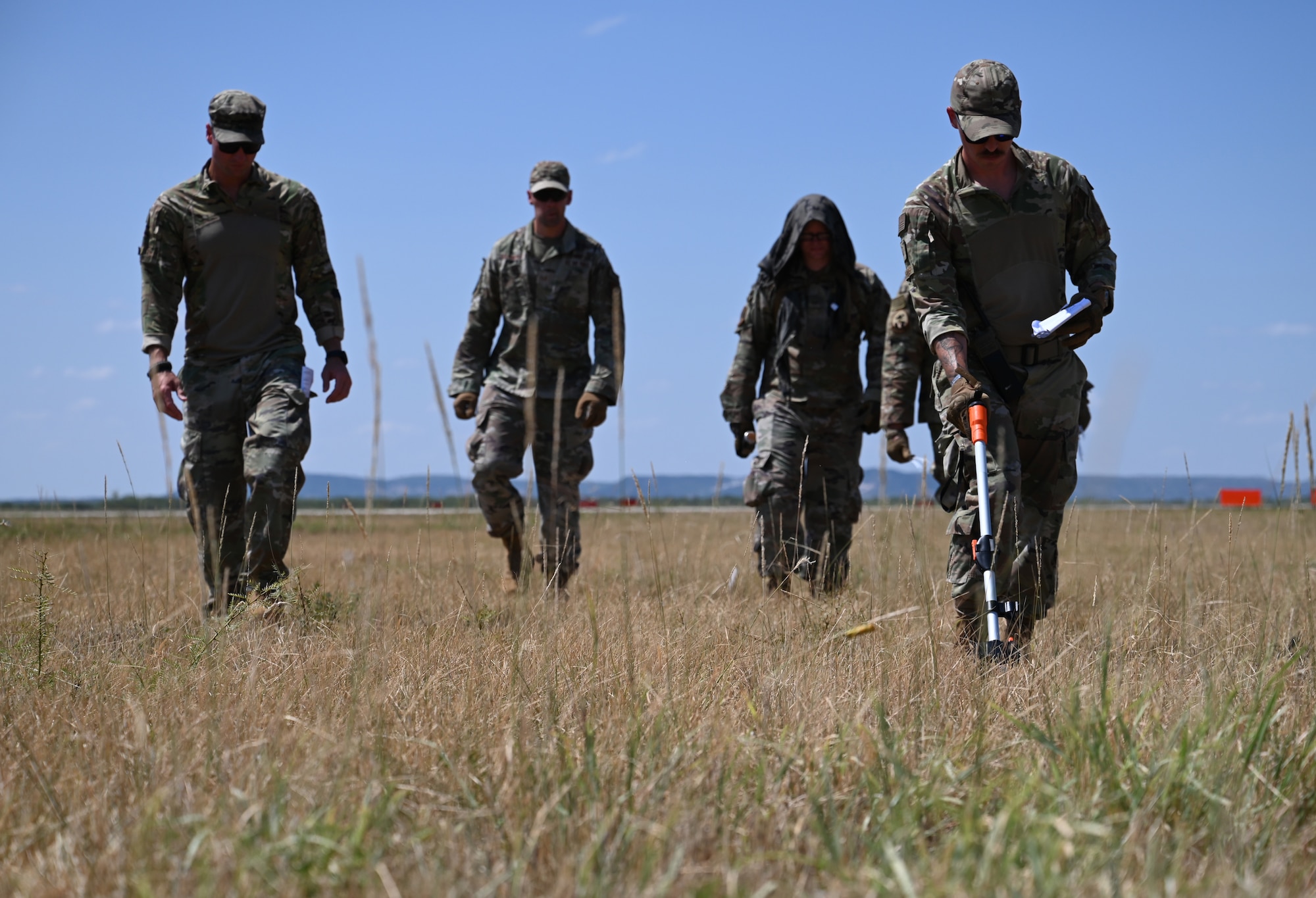 Landing Zone Safety Officer Exercise participants set up a landing zone during the LZSO Exercise at Dyess Air Force Base, Texas, July 12, 2024. During the course, air traffic control Airmen from Dyess and Offutt Air Force Base, Nebraska, set up a mock airfield to safely land four C-130J Super Hercules assigned to the 317th Airlift Wing. (U.S. Air Force photo by Staff Sgt. Holly Cook)