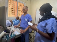 U.S. Air Force Col. David Jones, state flight surgeon with the Vermont Air National Guard, performs an ultrasound on a patient during a multi-national medical exercise in Tambacounda, Senegal, led by the Vermont National Guard on June 10, 2024. The exercise included Airmen and Soldiers with the Vermont and New Hampshire National Guard, medical teams with the Austrian and Senegalese armed forces who all worked alongside hospital teams located locations throughout Senegal.