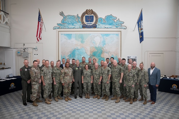 Chief of Naval Operations Adm. Lisa Franchetti and Master Chief Petty Officer of the Navy James Honea pose for a photo with senior officers and civilians at the CNO Futures Game at Naval Station Newport, Rhode Island, July 16, 2024. The Navy uses events like the CNO Futures Game as part of an ongoing series of Joint and Navy-sponsored events to shape and inform naval strategy, analysis, operational concepts, and warfighting requirements. (U.S. Navy photo by Senior Chief Mass Communication Specialist Elliott Fabrizio/released)