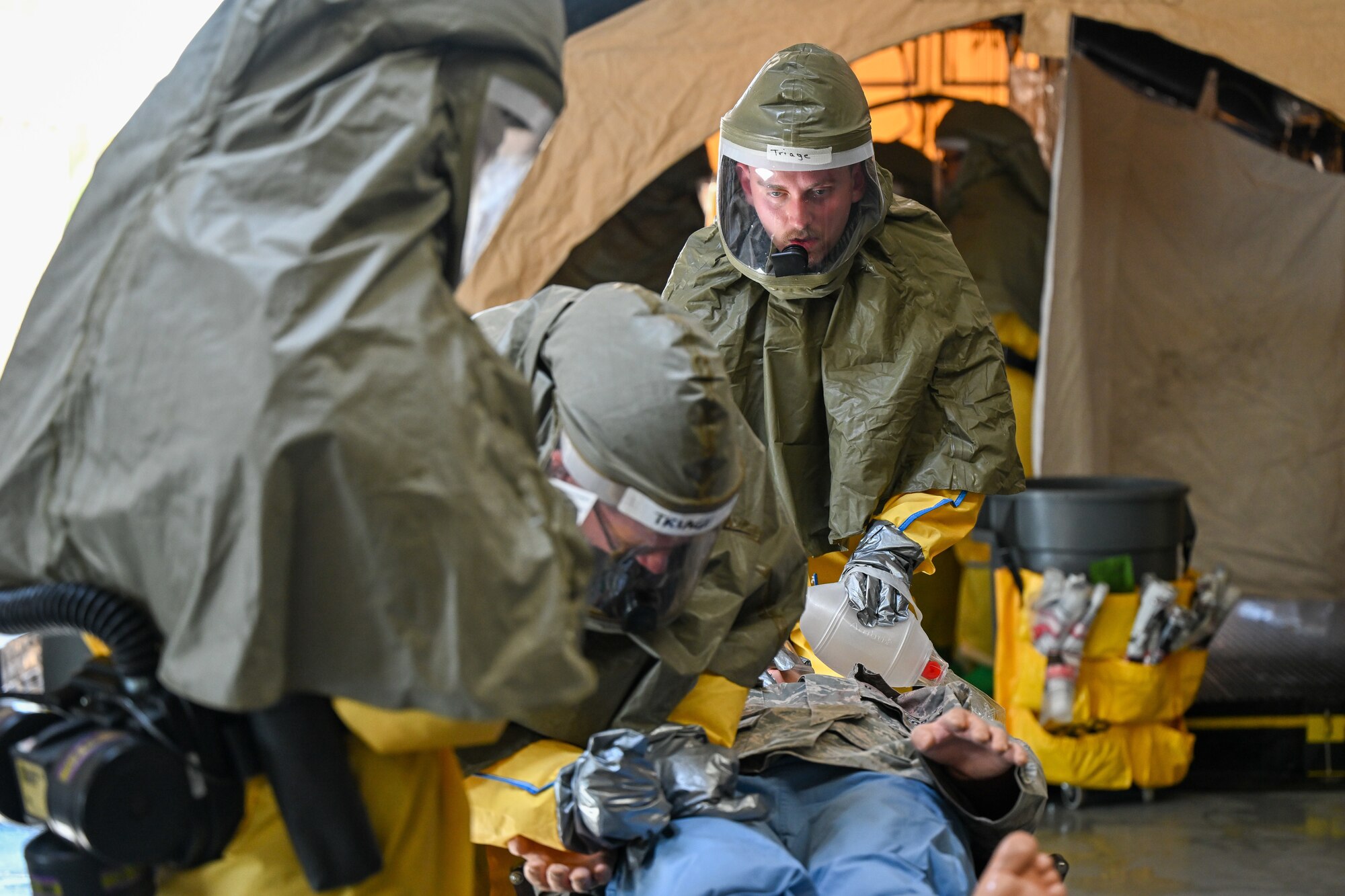 working in the decontamination tent