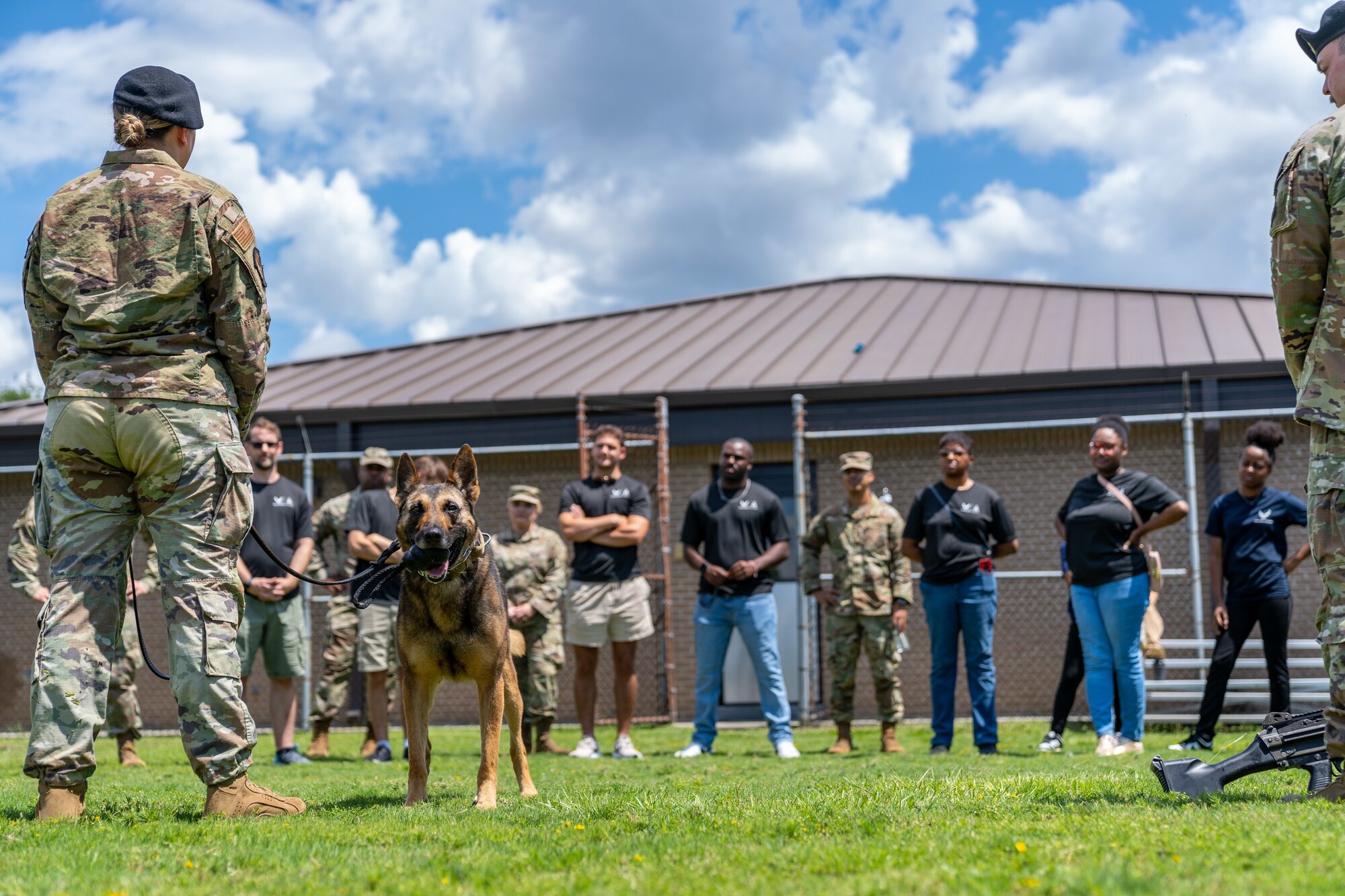 Enlistees assigned to the 331st Recruiting Squadron delayed entry program receive a briefing from the 81st Security Forces Squadron military working dog squadron during their tour of Keesler Air Force Base, Mississippi, July 11, 2024. These future Airmen and Guardians received the tour to better understand the various career fields within the Air Force and Space Force. (U.S. Air Force photo by Andrew Young)