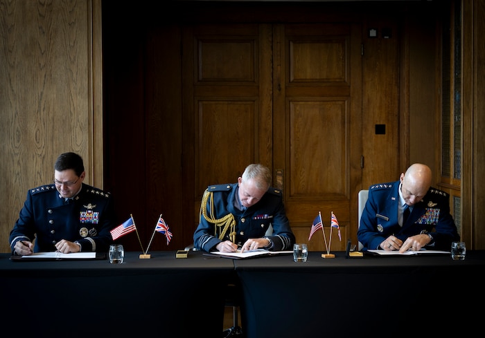 U.S. Space Force Chief of Space Operations Gen. Chance Saltzman, Royal Air Force Chief of the Air Staff Air Chief Marshal Sir Rich Knighton, and U.S. Air Force Chief of Staff Gen. David Allvin sign a Shared Vision Statement on Combined Air and Space Power in the 21st Century at the RAF’s Global Air & Space Chiefs’ Conference in London, United Kingdom, July 17, 2024.