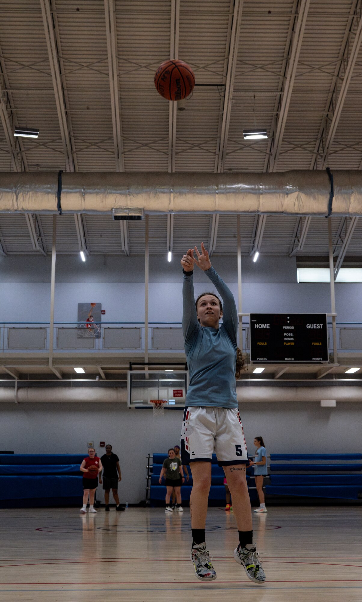 U.S. Air Force Airman 1st Class Emily Leavitt, 5th Logistics Readiness Squadron household goods technician and Lady Bomber, takes a shot at Minot Air Force Base, North Dakota, July 10, 2024. Leavitt has been playing basketball for 14 years. (U.S. Air Force photo by Airman 1st Class Alyssa Bankston)