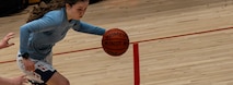 U.S. Air Force Airman 1st Class Emily Leavitt, 5th Logistics Readiness Squadron household goods technician and Lady Bomber, dribbles a women’s basketball during a Minot Air Force Base (AFB) Lady Bombers basketball practice session at Minot AFB, North Dakota, July 10, 2024. The Lady Bombers are part of the Women’s Military Basketball Association, consisting of teams across multiple military branches. (U.S. Air Force photo by Airman 1st Class Alyssa Bankston)