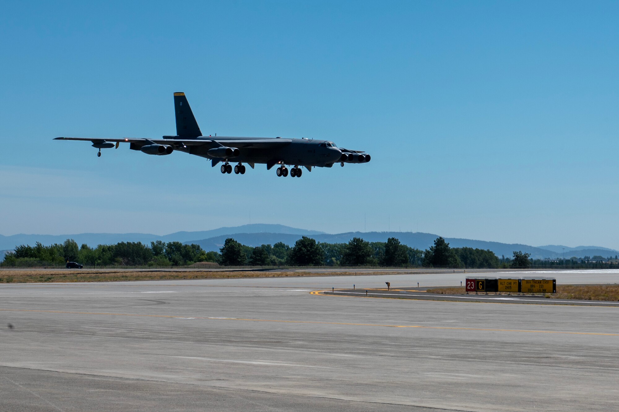 A B-52H Stratofortress assigned to the 69th Bomb Squadron prepares to land at Fairchild Air Force Base, Washington, July 15, 2024. Four B-52’s arrived from Minot AFB to Fairchild AFB for Agile Combat Employment integration event, Agile Warbird. Staying sharp and agile requires constant training opportunities and diverse unit integration. Strategic bombers contribute to stability across all theaters, as they are intended to deter conflict rather than instigate it. If called upon, U.S. bombers offer a rapid response capability. (U.S. Air Force photo by Senior Airman Morgan St Marks)
