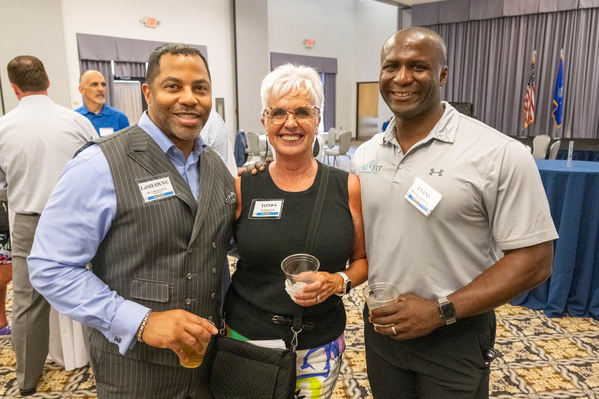 LaShawne Pryor, Tonda Parks and Evans Armantrading, former Dover Air Force Base honorary commanders, reconnect during an Ambassador Program Social at Dover AFB, Delaware, July 16, 2024. The new Ambassador Program is designed with a dual purpose to nurture and maintain enduring relationships between past HCCs and Dover AFB and to provide a platform for Ambassadors to serve as mentors to current and aspiring HCCs. (U.S. Air Force photo by Mauricio Campino)