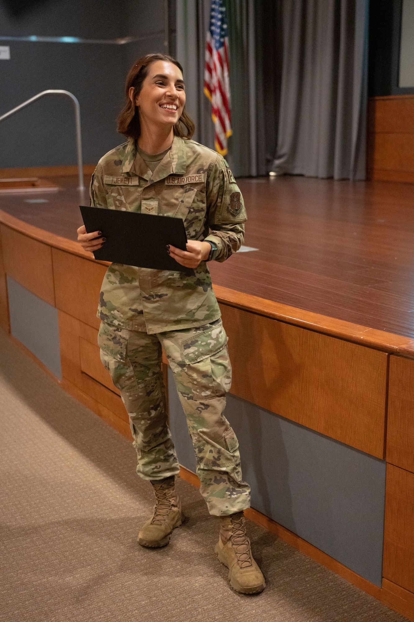 U.S. Air Force Airman 1st Class Victoria Jewett, a public affairs specialist with the 156th Wing, Puerto Rico Air National Guard, receives a first-place certificate in the Multimedia Product category of the Air National Guard Media Awards Competition from Tracey O' Grady-Walsh, director of Public Affairs for the National Guard Bureau, during the National Guard's annual Public Affairs Training Workshop Conference at the Mark Center, Alexandria, Virginia, July 11, 2024. The PATW is a three-day training event that is attended primarily by speakers and public affairs professionals providing expansive talks from strategic leaders and collaborative networking to bridge the PA community across the 54 U.S. states and territories. (U.S. Air National Guard photo by Master Sgt. Rafael D. Rosa)