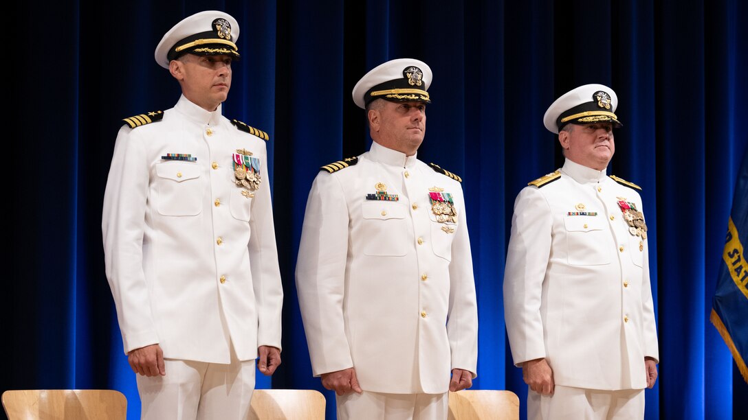 Commander, Naval Surface Warfare Center/Naval Undersea Warfare Center, Rear Adm. Todd Evans (right), former NSWC Carderock Commanding Officer Capt. Matthew Tardy (center), and the new NSWC Carderock Commanding Officer Christopher Matassa (left) stand together.