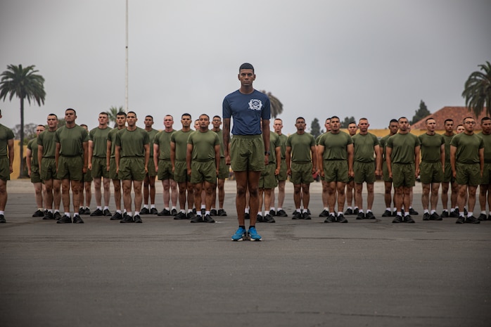 U.S Marine Corps Sgt. Brandon Simon, a drill instructor with India Company, 3rd Recruit Training Battalion, prepares to lead dynamic warm-ups prior to a motivational run at Marine Corps Recruit Depot San Diego, California, July 11, 2024. The company motivational run is a three-mile cadence run conducted around the Depot, the last physical training event the Marines will conduct before they graduate from MCRD San Diego, and the first time their friends and families will see their newly transformed Marines. (U.S. Marine Corps photo by Lance Cpl. Francisco Angel)