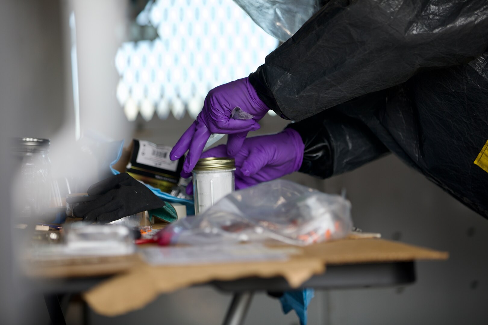 Members of the 33rd Weapons of Mass Destruction-Civil Support Team (WMD-CST), District of Columbia National Guard, review samples in an improvised lab during a training exercise in Lihue, Hawaii, on June 7, 2024. The exercise poised military and civilian response partners to better integrate capabilities when disaster strikes.