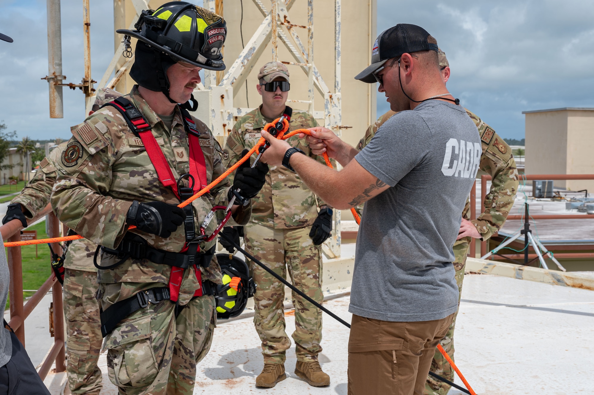 U.S. Air Force Tech. Sgt. Brittany Souder, left, 36th Tactical Advisory Squadron independent duty medical technician, and Tech. Sgt. Kyle Yeomans, 36 TAS survival, evasion, resistance and escape specialist, rappel during rescue technician training at Andersen Air Force Base, Guam, July 16, 2024.
