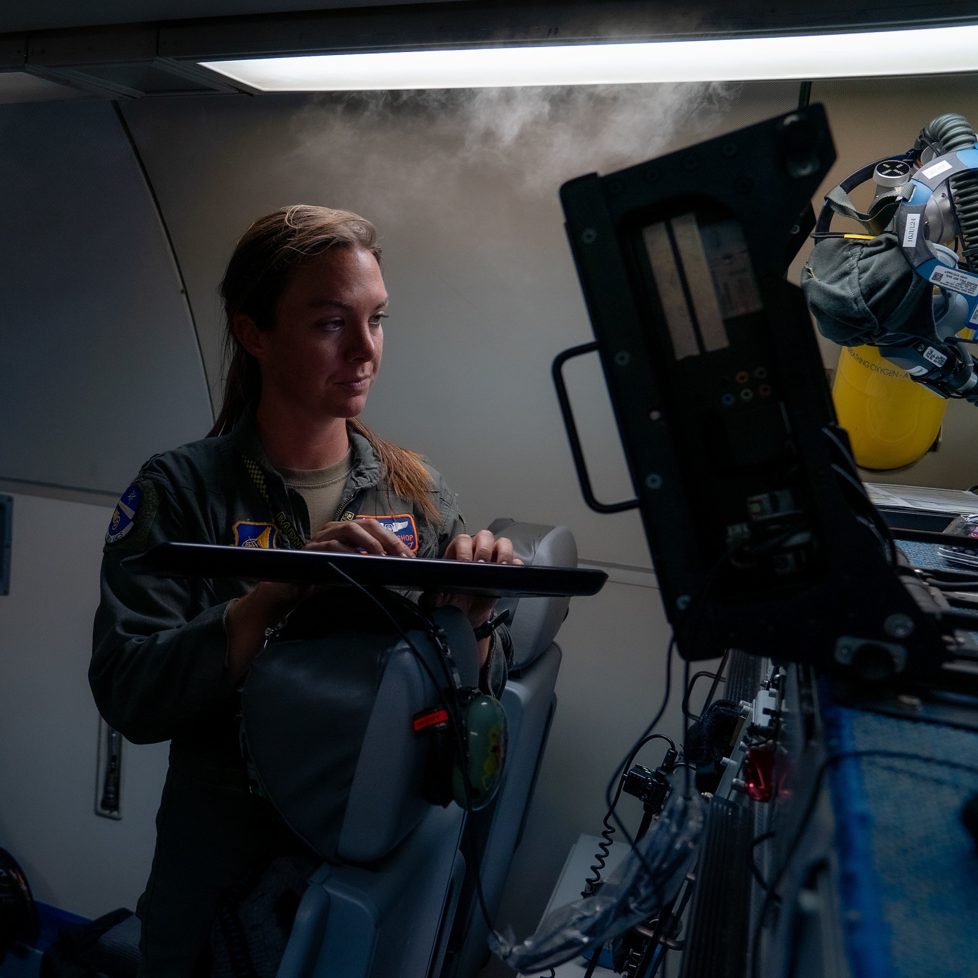 Airman operating AWACS computer
