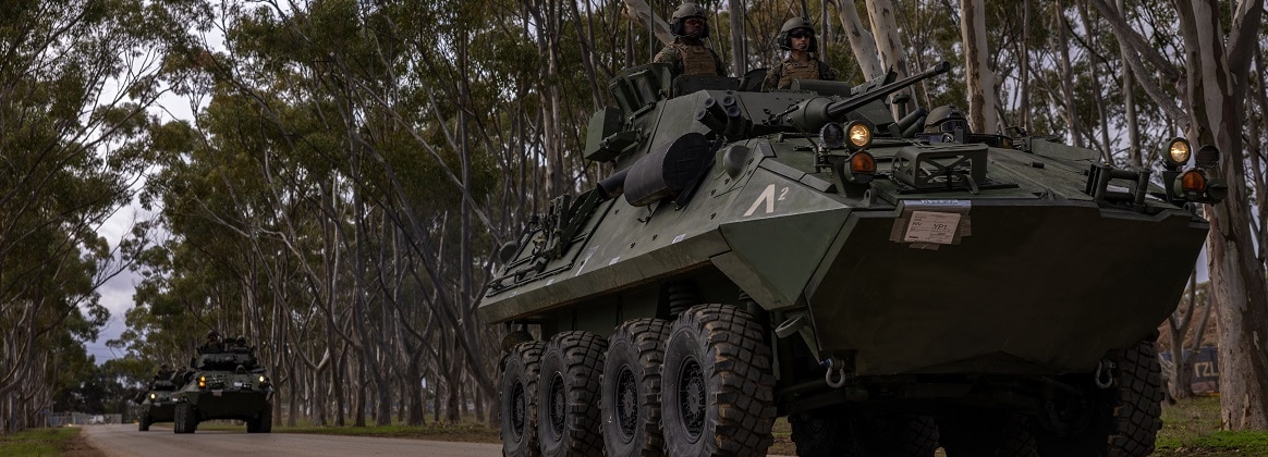 U.S. Marines with Alpha Company, 1st Light Armored Reconnaissance Battalion, 1st Marine Division, drive LAV-25 Light Armored Vehicles to the range to boresight their weapons during Rapid Deployment Exercise at Royal Australian Air Force Base Edinburgh, SA, Australia, July 16, 2024.