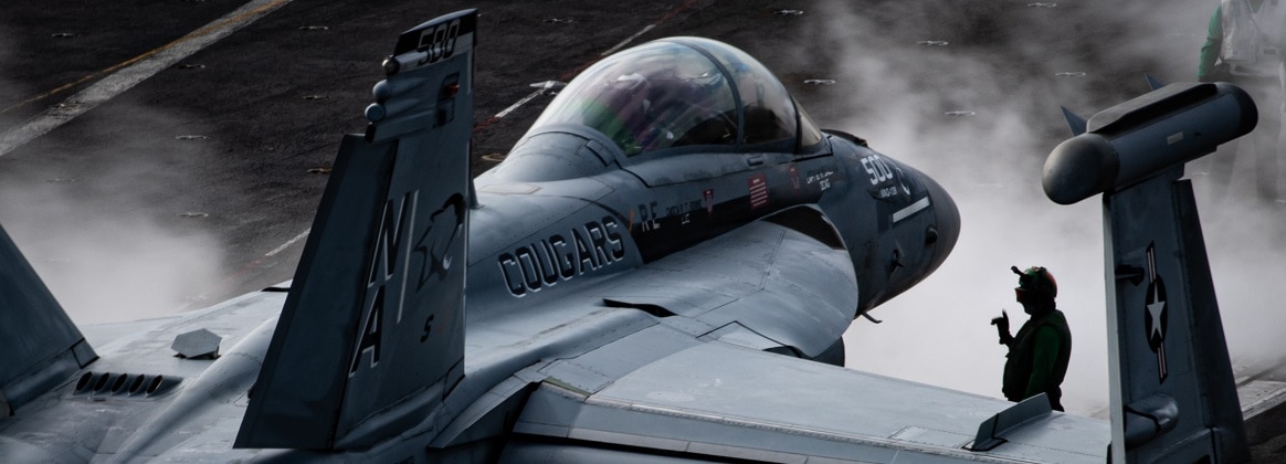Sailors prepare an E/A-18G Growler from the “Cougars” of Electronic Attack Squadron (VAQ) 139 for launch from the flight deck of the aircraft carrier USS Nimitz (CVN 68) July 14, 2024.