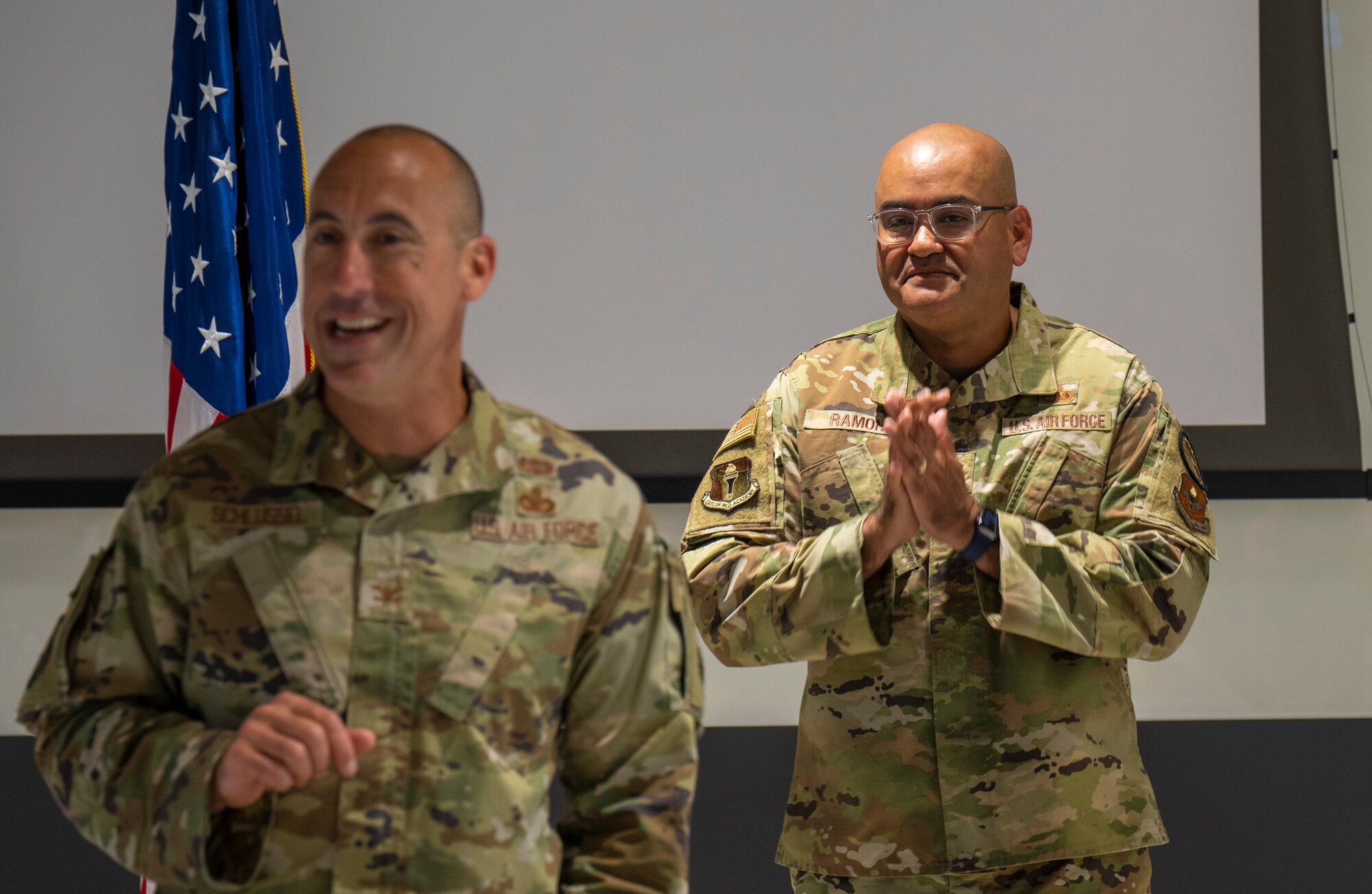 Chief Master Sgt. Jason Ramon, right, prepared to reenlist during the 2024 Summer Commandants Conference in Montgomery, Ala., July 8-12. The conference, which included 21 commandants from Air Force noncommissioned officer academies and above, was hosted by the Thomas N. Barnes Center for Enlisted Education and focused on the development of ideas and planning of EPME execution and strategic direction through 2029.  (U.S. Air Force photo/Brian Ferguson)