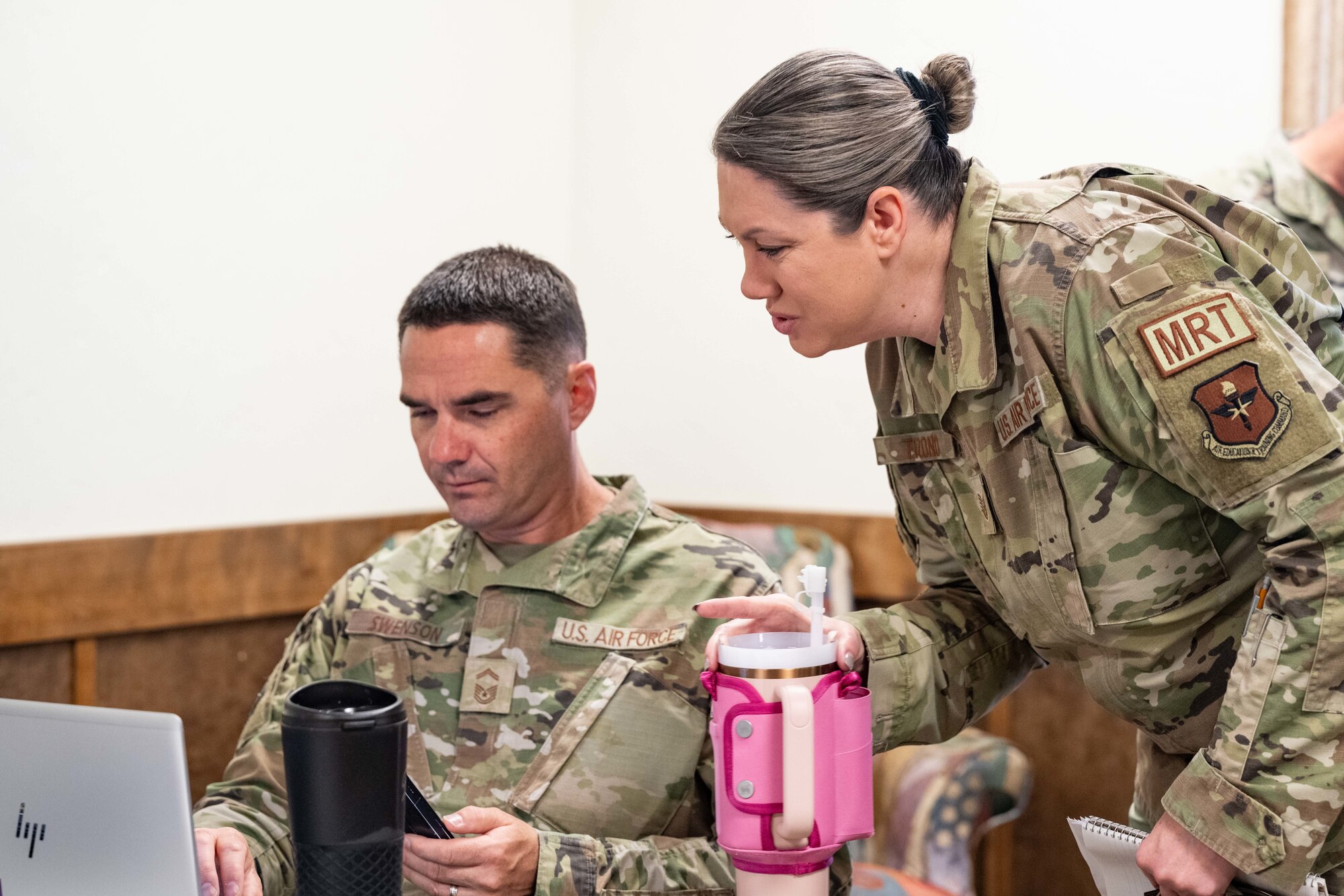 U.S. Air Force Senior Master Sgt. Troy Swenson, 49th Component Maintenance Squadron maintenance superintendent and course instructor, left, and U.S. Air Force Tech. Sgt. Tasha Tizono, 49th Component Maintenance Squadron section chief, go over a list of topics ahead of the 49er Flight Leadership Course at Holloman Air Force Base, New Mexico, July 10, 2024.