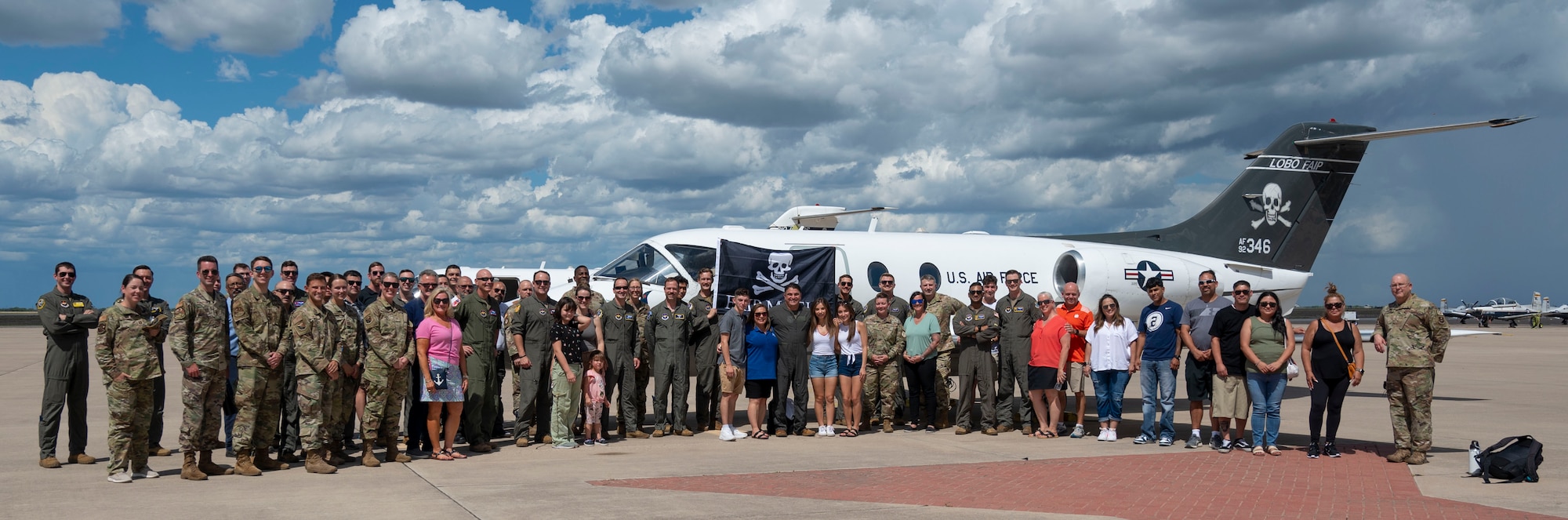 U.S. Air Force Col. Andrew Katz (center), 47th Flying Training Wing (FTW) deputy commander and Laughlin’s oldest T-1A First Assignment Instructor Pilot, and Capt. Cory Villarreal, 86th Flying Training Squadron’s last T-1A FAIP, pose alongside a group of Airmen in front of a T-1A Jayhawk at Laughlin Air Force Base, Texas, July 15, 2024. Katz was joined by fellow members of the 47th FTW after his “fini” flight, his final flight before his retirement from active duty, to celebrate his time in service. (U.S. Air Force photo by Senior Airman Kailee Reynolds)