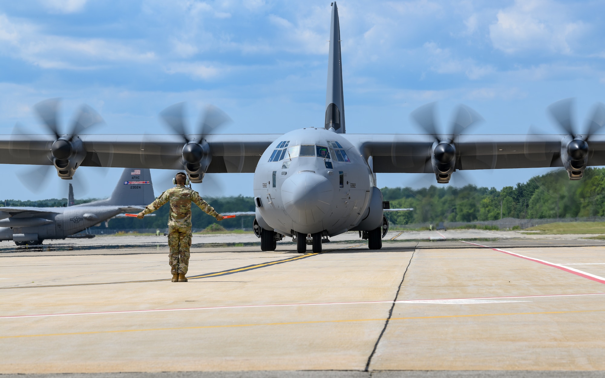 The 910th Airlift Wing’s first C-130J-30 Super Hercules aircraft is marshalled to its arrival ceremony, on July 16, 2024, at Youngstown Air Reserve Station, Ohio.