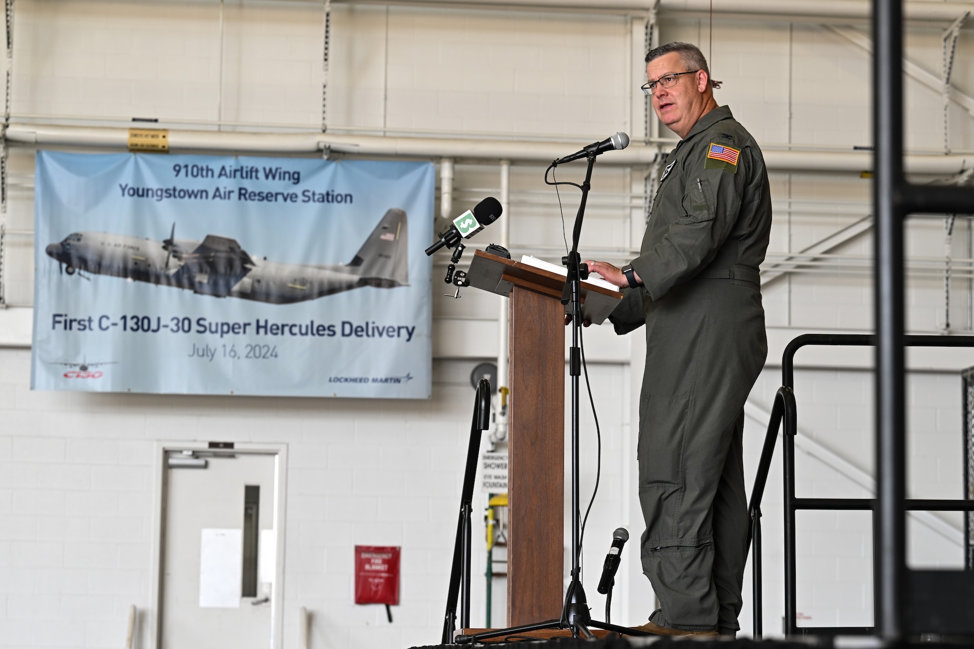 Col. Mike Maloney, commander of the 910th Airlift Wing, speaks at an arrival ceremony celebrating the 910th AW’s first C-130J-30 Super Hercules aircraft on July 16, 2024, at Youngstown Air Reserve Station, Ohio.