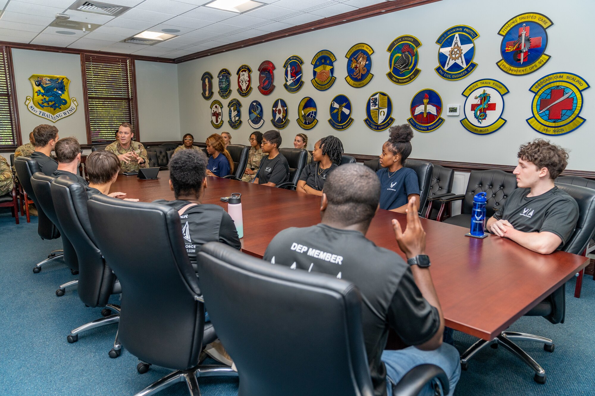 Enlistees assigned to the 331st Recruiting Squadron delayed entry program speak with U.S. Air Force Chief Master Sgt. Michael Venning, 81st Training Wing command chief, during their tour of Keesler Air Force Base, Mississippi, July 11, 2024. These future Airmen and Guardians received the tour to better understand the various career fields within the Air Force and Space Force.(U.S. Air Force photo by Andrew Young)