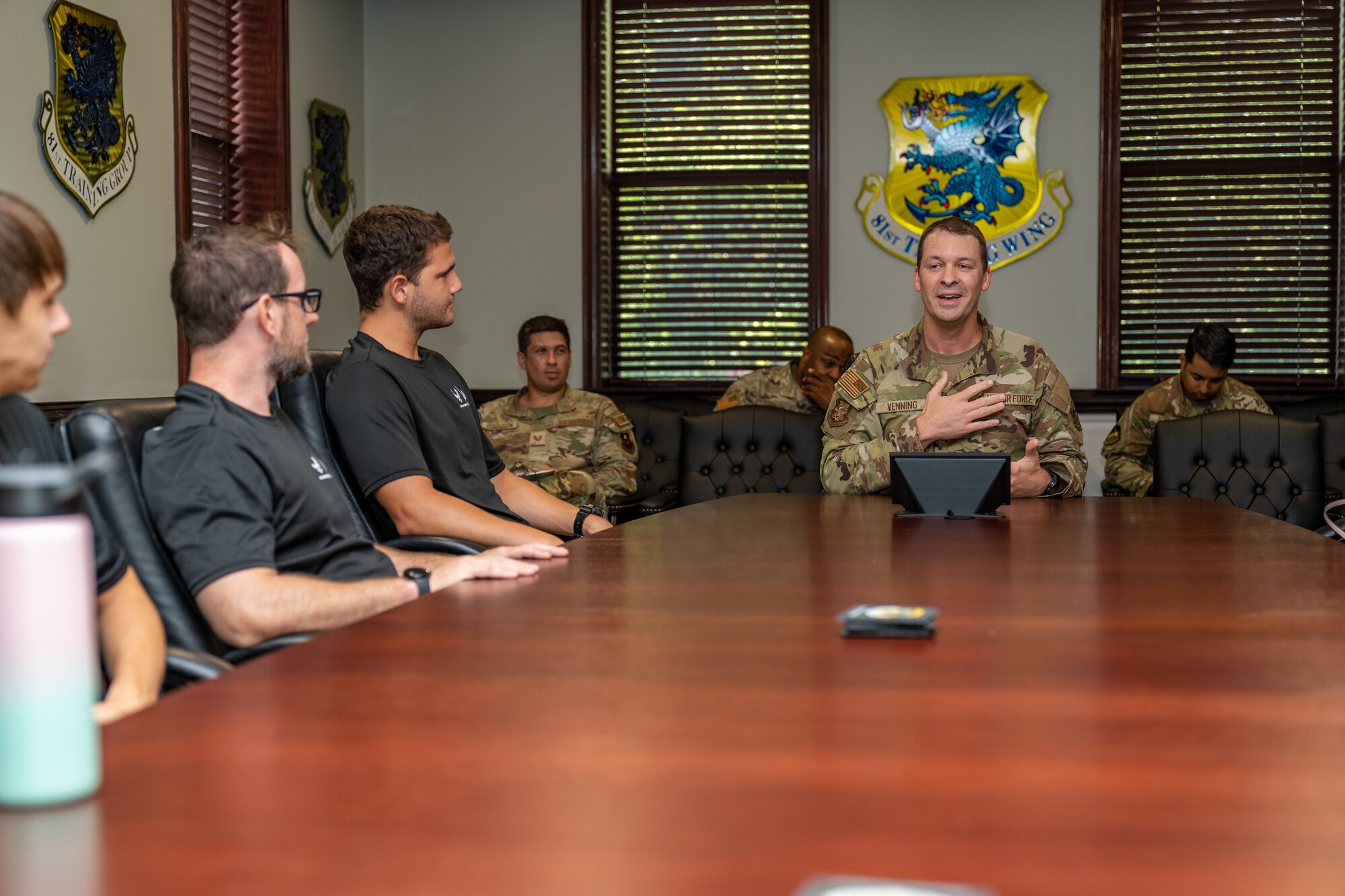 Enlistees assigned to the 331st Recruiting Squadron delayed entry program speak with U.S. Air Force Chief Master Sgt. Michael Venning, 81st Training Wing command chief, during their tour of Keesler Air Force Base, Mississippi, July 11, 2024. These future Airmen and Guardians received the tour to better understand the various career fields within the Air Force and Space Force.(U.S. Air Force photo by Andrew Young)